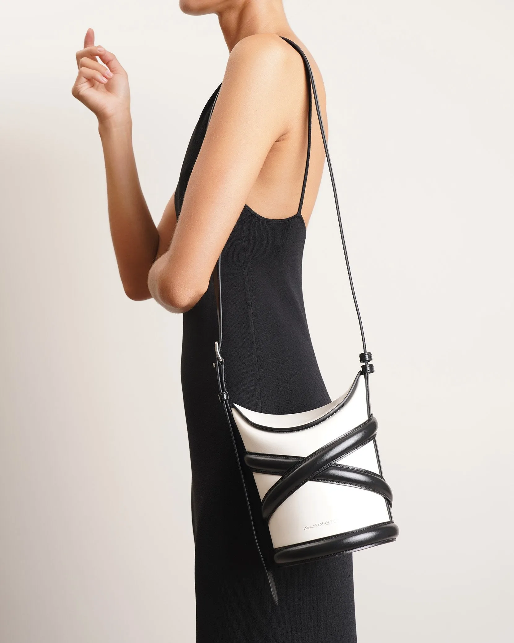 The Curve soft ivory and black bucket bag